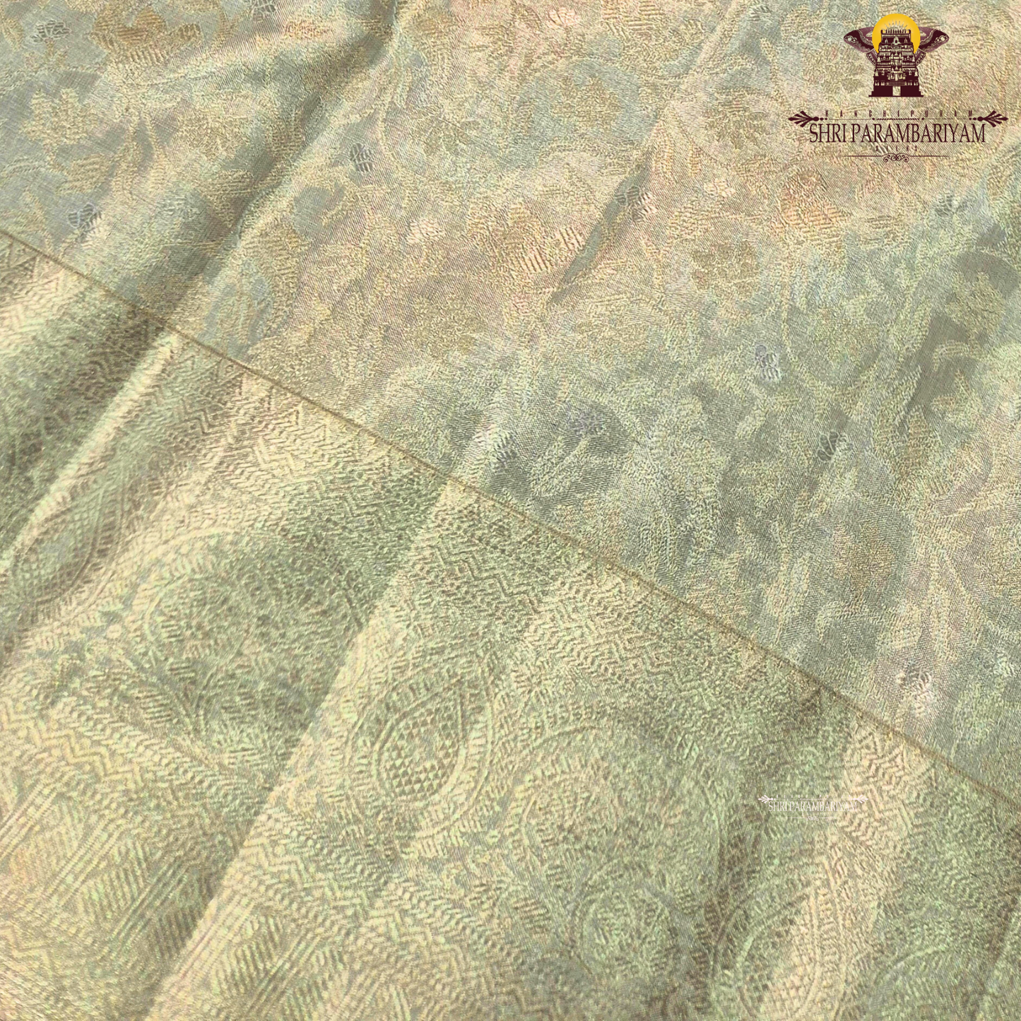 A soft light gold (champagne gold) shade that gives a rich and elegant Saree