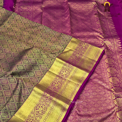 Rich rani pink (magenta) base with an opulent antique gold zari weave Saree