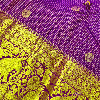 Vibrant royal purple shade, beautifully accentuated with gold zari Saree