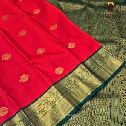 Bright Vermilion Red body with a deep Bottle Green border Saree