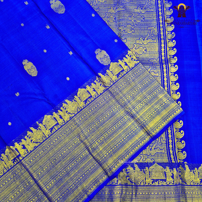 A vibrant royal blue body adorned with elegant gold zari Saree