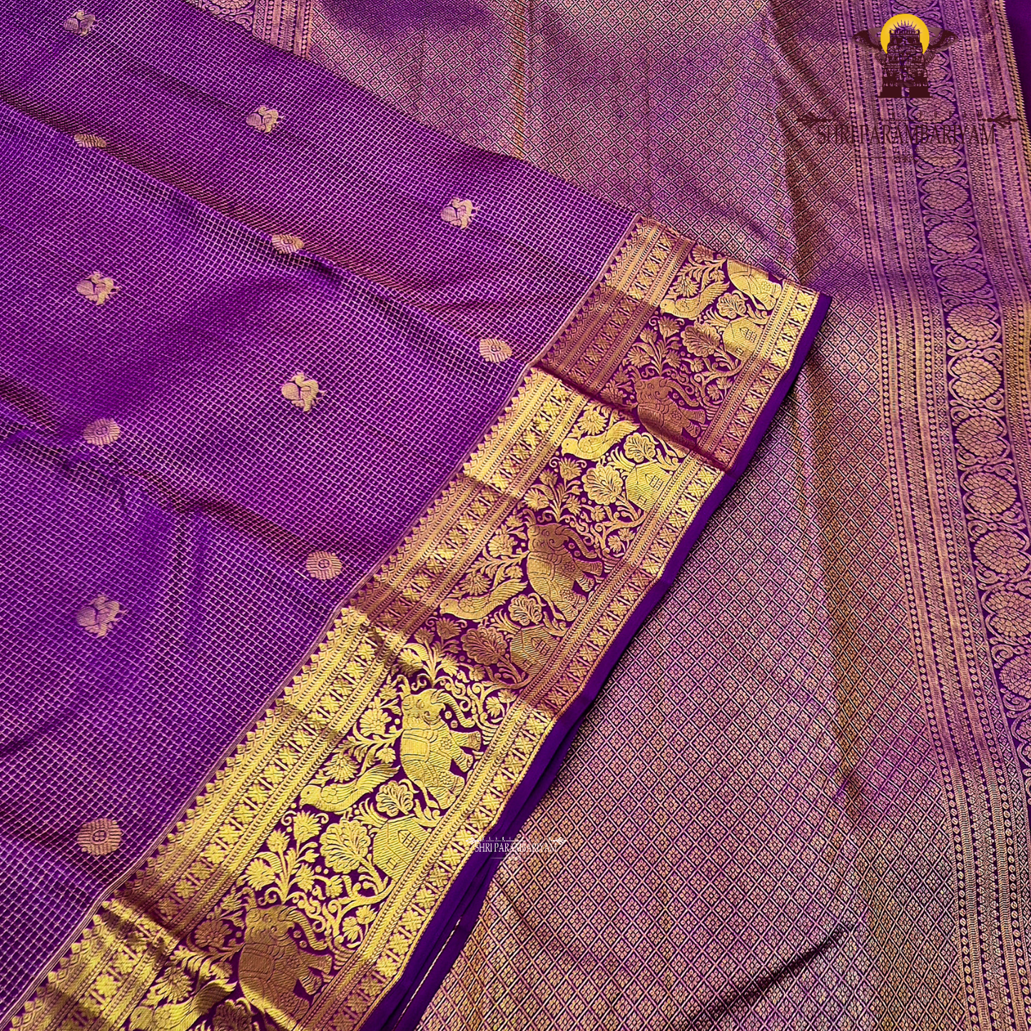 Vibrant royal purple shade, beautifully accentuated with gold zari Saree