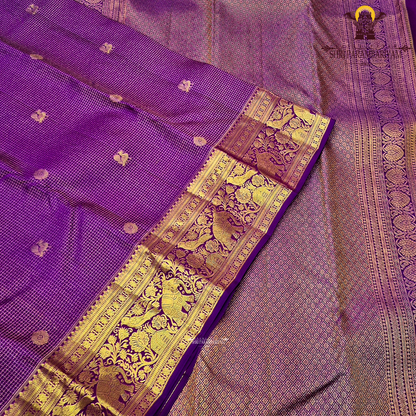 Vibrant royal purple shade, beautifully accentuated with gold zari Saree