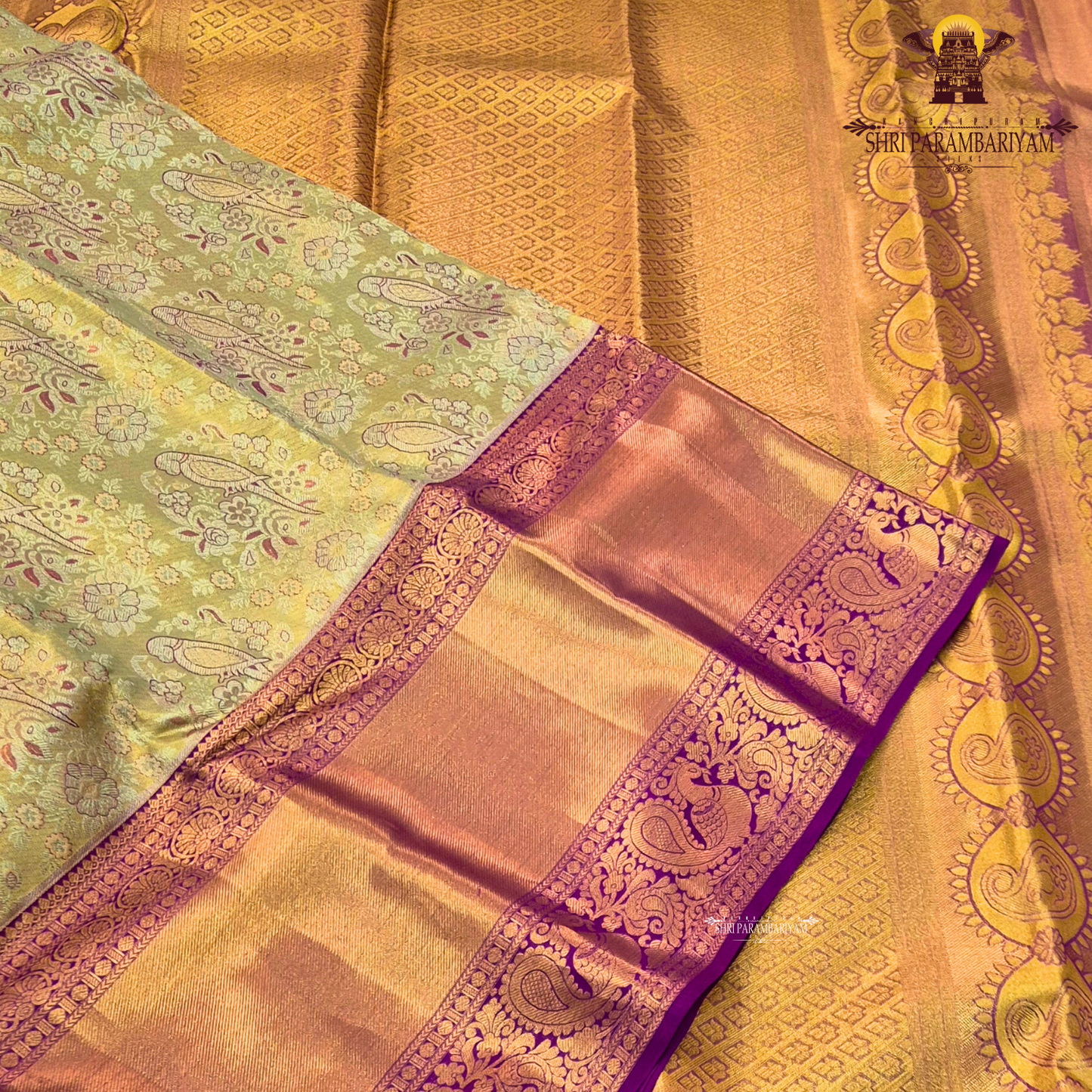 Rich antique gold/copper-toned tissue body paired with a vibrant deep magenta border Saree