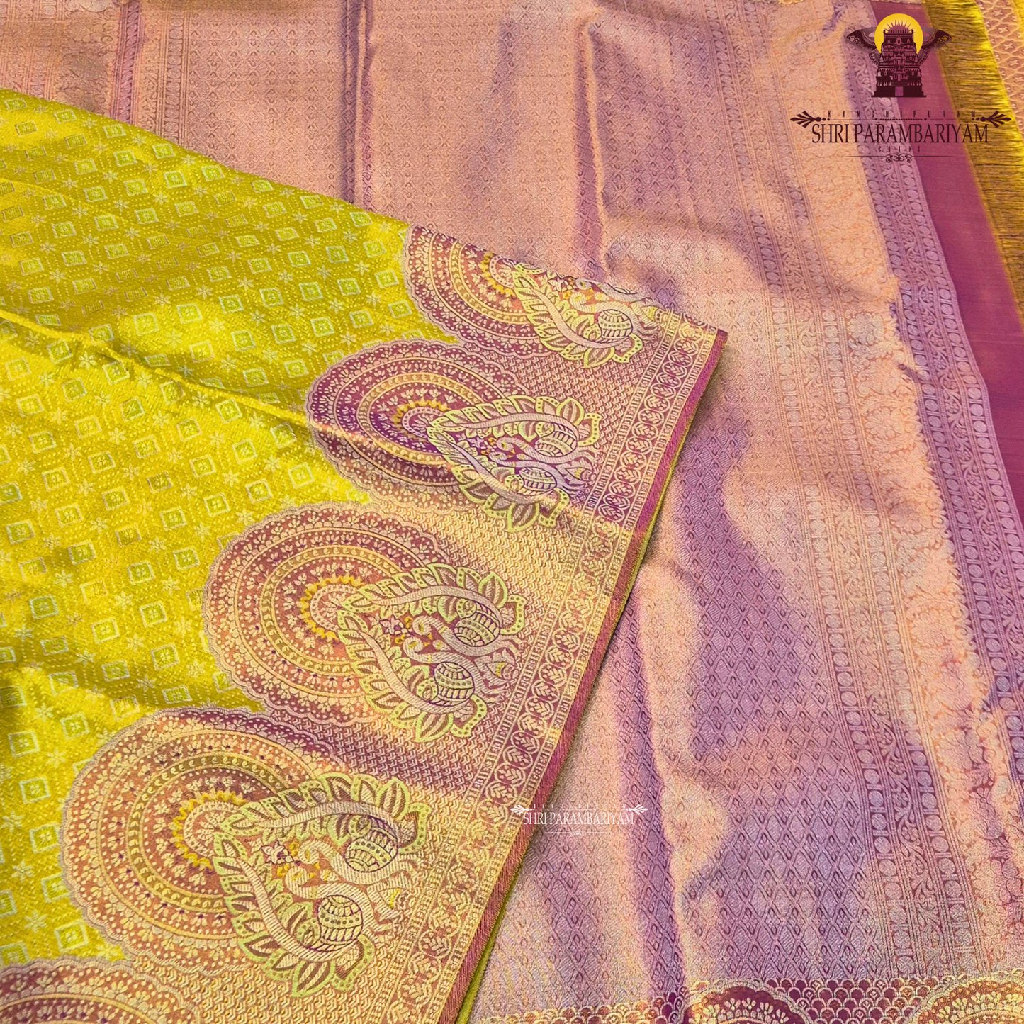 A vibrant parrot yellow / lime yellow tissue base paired with a rich magenta-pink Saree