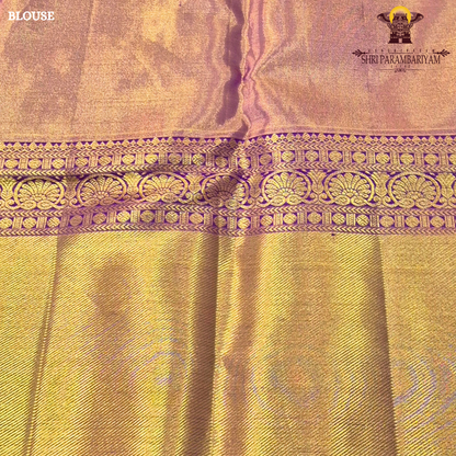 Rich antique gold/copper-toned tissue body paired with a vibrant deep magenta border Saree