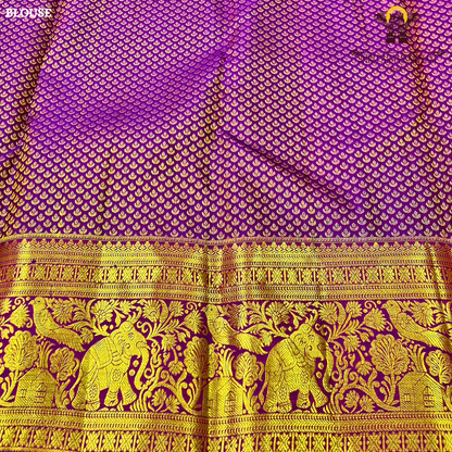Vibrant royal purple shade, beautifully accentuated with gold zari Saree