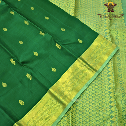 A rich emerald green body paired with a self-toned light green border enhanced Saree