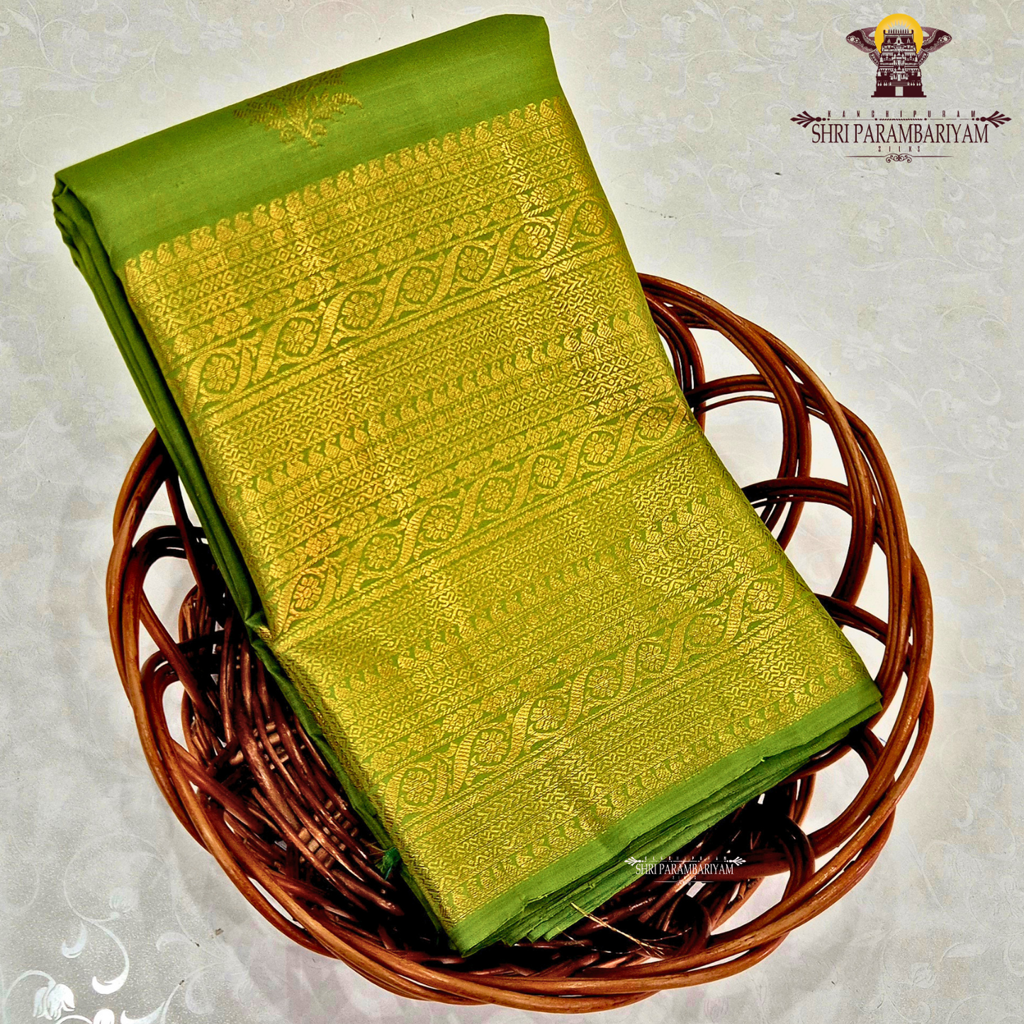 A rich Parrot Green with rich Gold zari work Saree