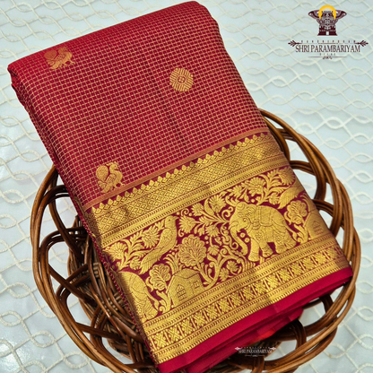 A classic and traditional maroon with gold combination Saree