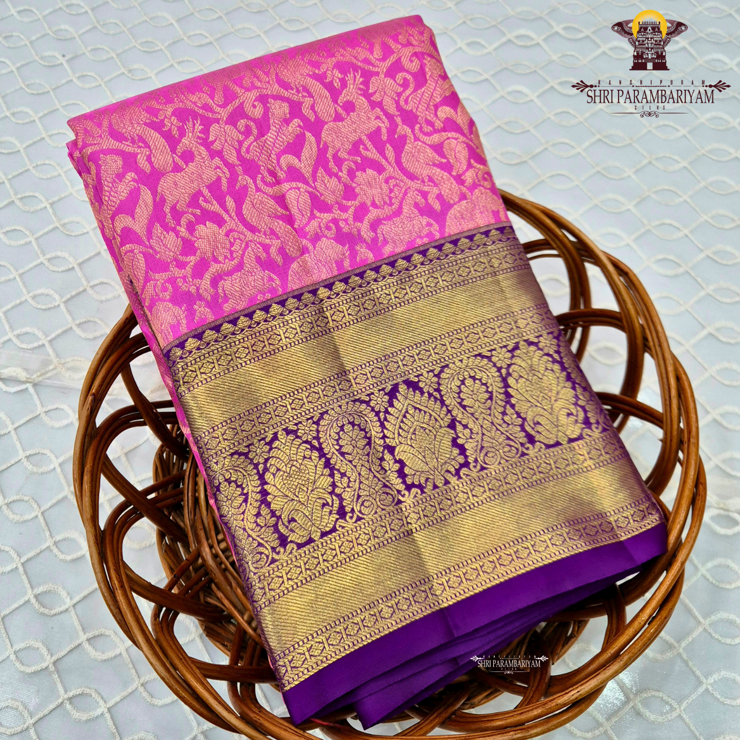 A bright bubblegum pink / rose pink body paired with a rich royal purple Saree