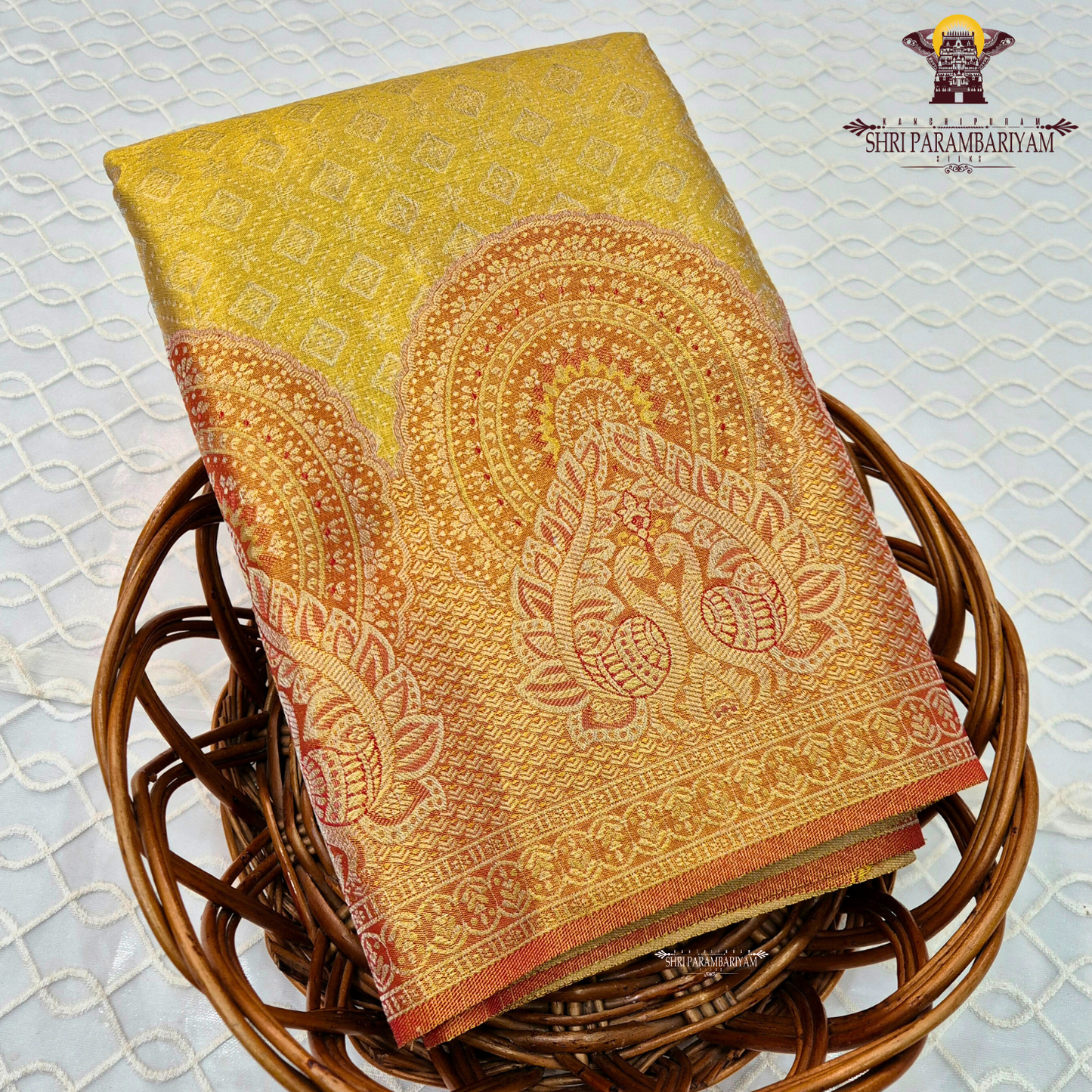 A bright mustard yellow / turmeric yellow tissue base paired with a rich rust orange Saree