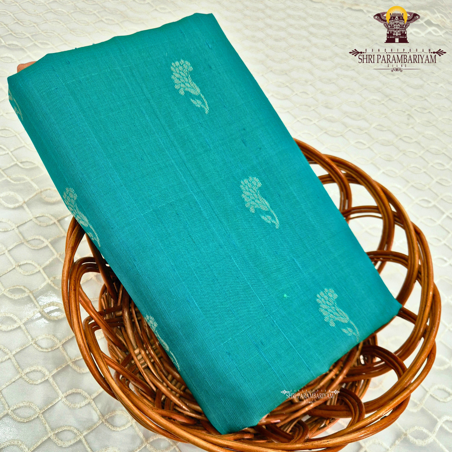 A rich peacock teal green shade that beautifully blends vibrance with elegance Saree