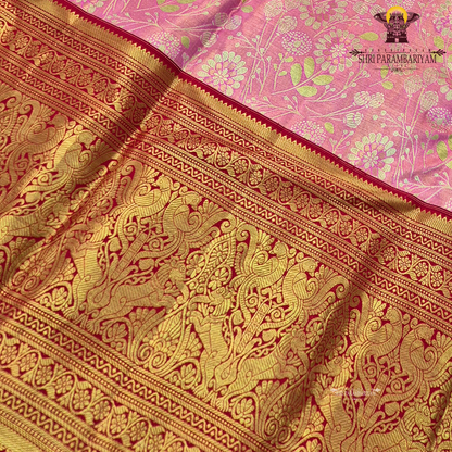 Soft pastel pink (tissue body) with a rich deep red border Saree