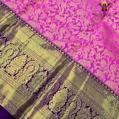 A bright bubblegum pink / rose pink body paired with a rich royal purple Saree