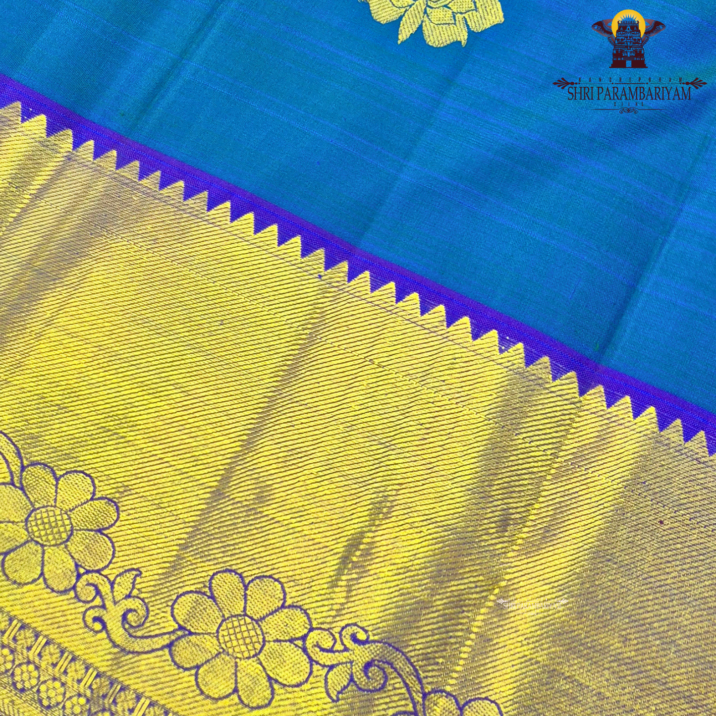 A beautiful dual-tone teal blue with hints of green, complemented by a contrast Saree