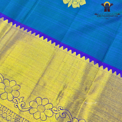A beautiful dual-tone teal blue with hints of green, complemented by a contrast Saree