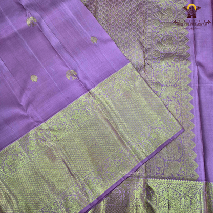 A graceful rose pink body highlighted with delicate gold zari Saree