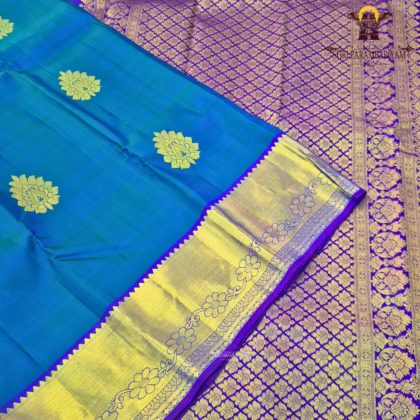 A beautiful dual-tone teal blue with hints of green, complemented by a contrast Saree
