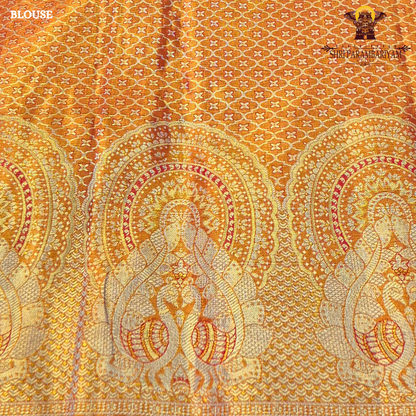 A bright mustard yellow / turmeric yellow tissue base paired with a rich rust orange Saree
