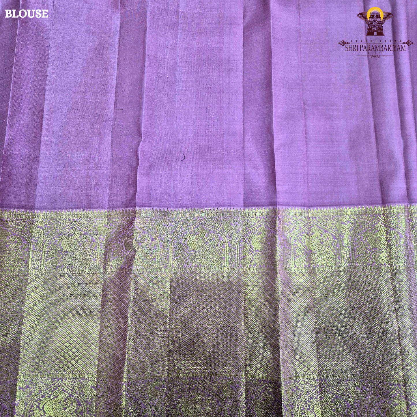 A graceful rose pink body highlighted with delicate gold zari Saree