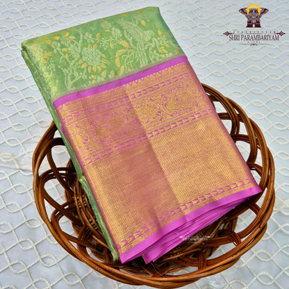 A refreshing leaf green (tissue body) paired with a vibrant magenta/pink border Saree