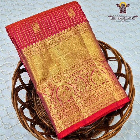A vibrant and festive rani pink with heavy gold richness Saree