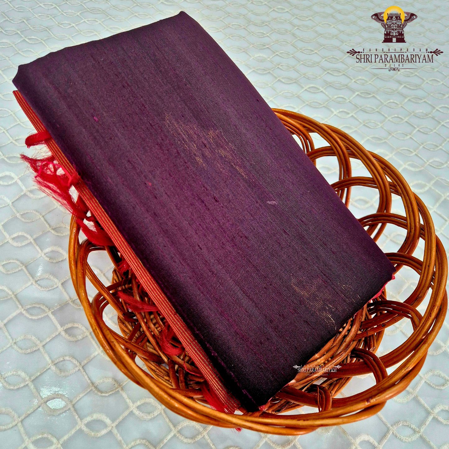 A rich deep plum purple shade with subtle natural sheen Saree