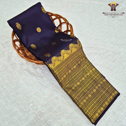 A rich deep navy blue body embellished with elegant gold zari Saree
