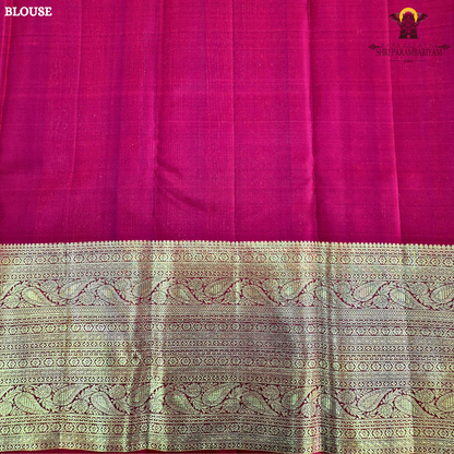 A luxurious deep black grape shade, adorned with delicate gold zari Saree