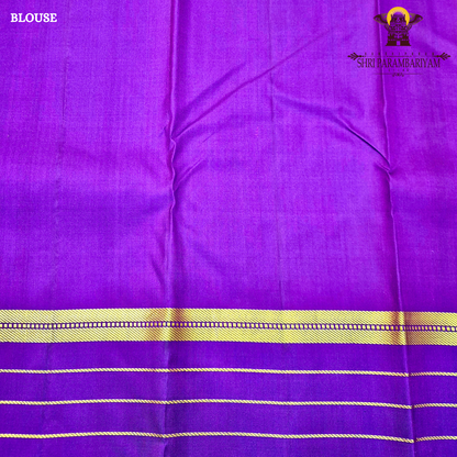 A rich mustard orange body paired beautifully with a deep royal purple pallu and border Saree