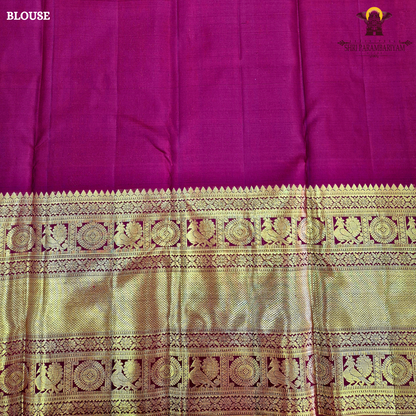 A rich maroon shade, beautifully adorned with elegant gold zari Saree