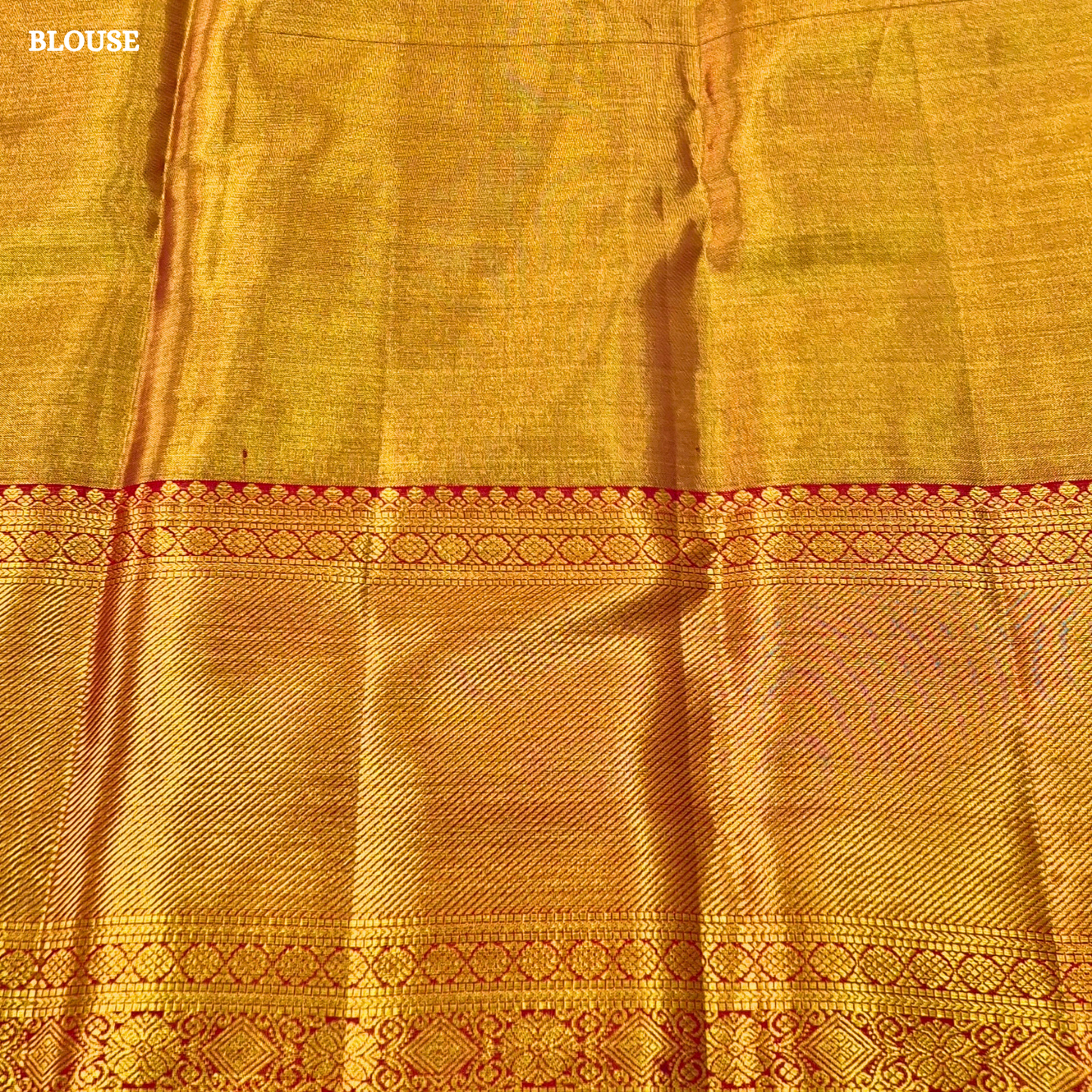 Rich dual-tone blend of antique gold and teal green Saree