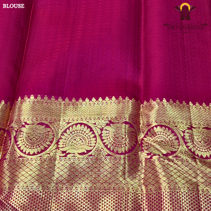 A rich and regal deep magenta / rani pink base adorned with opulent antique gold zari work Saree