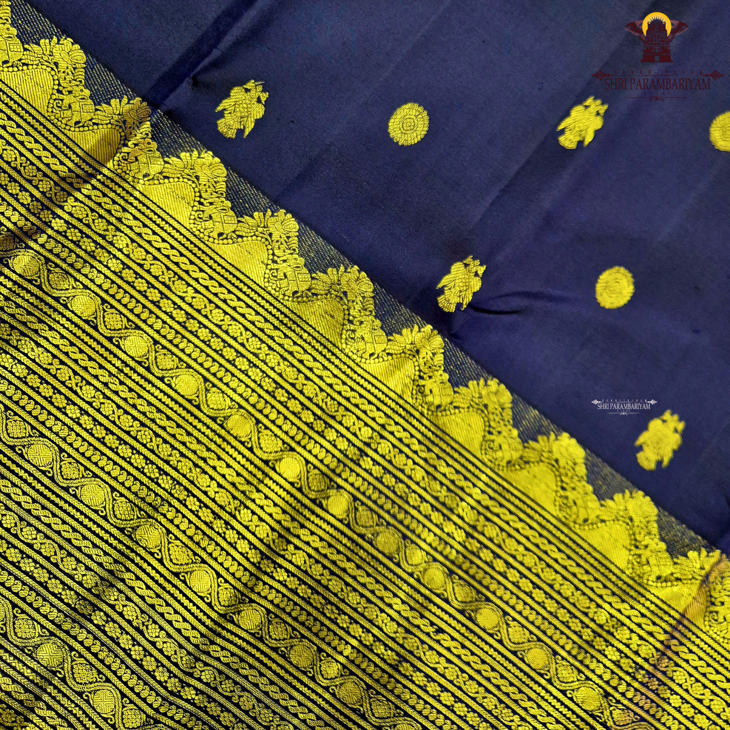 A rich deep navy blue body embellished with elegant gold zari Saree