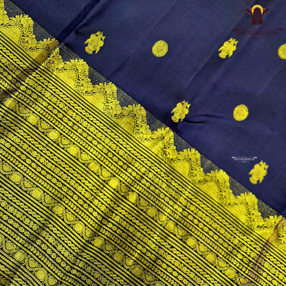 A rich deep navy blue body embellished with elegant gold zari Saree