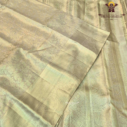 A sophisticated champagne gold shade that radiates a soft, luxurious sheen Saree