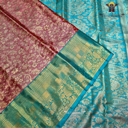 Elegant brick red / maroon tone with a soft tissue sheen Saree