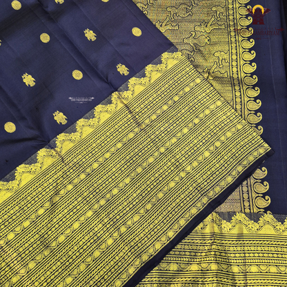A rich deep navy blue body embellished with elegant gold zari Saree