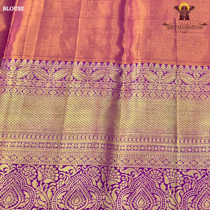 A radiant teal green tissue body paired with a rich royal purple border Saree