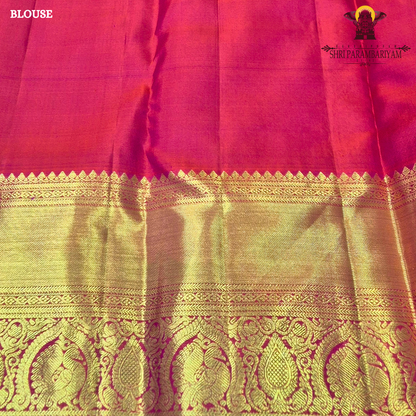 A vibrant and festive rani pink with heavy gold richness Saree