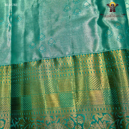 Elegant brick red / maroon tone with a soft tissue sheen Saree