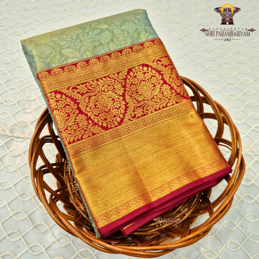 A refreshing pastel mint green (sea green) body paired with a rich deep red border Saree