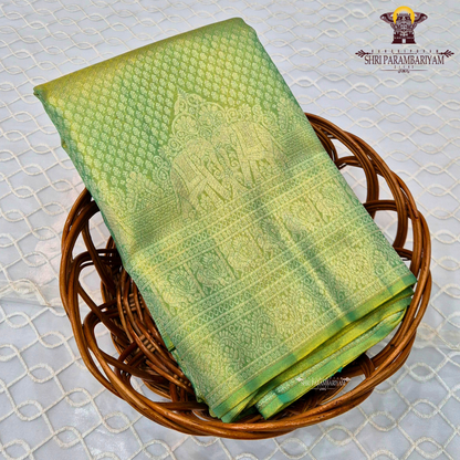 A refreshing leaf green shade blended with a luminous golden tissue finish Saree