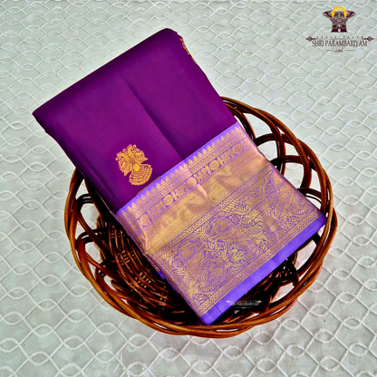 A rich royal purple body with a lustrous finish, beautifully complemented Saree