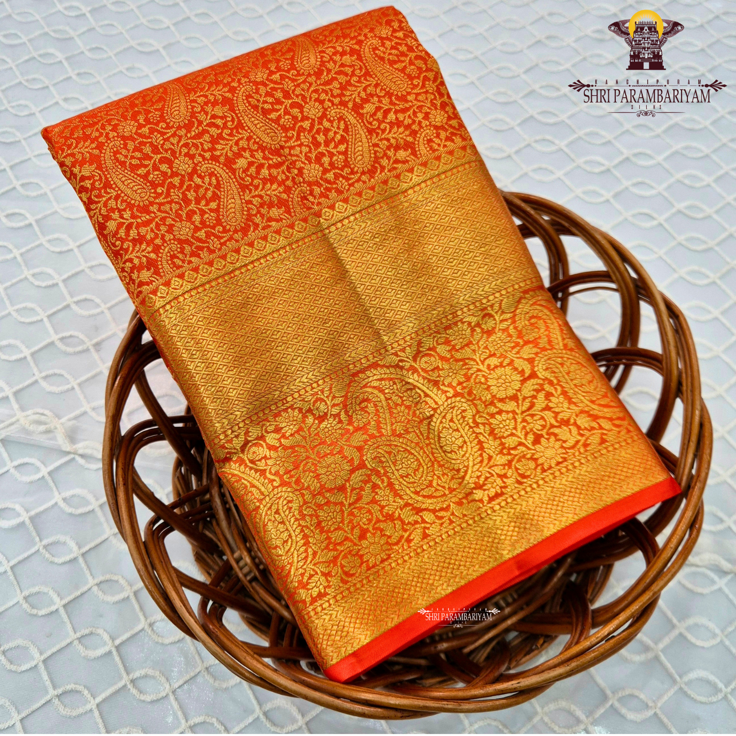 Bright vermilion orange / reddish orange with rich gold zari Saree