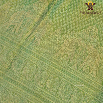 A refreshing leaf green shade blended with a luminous golden tissue finish Saree