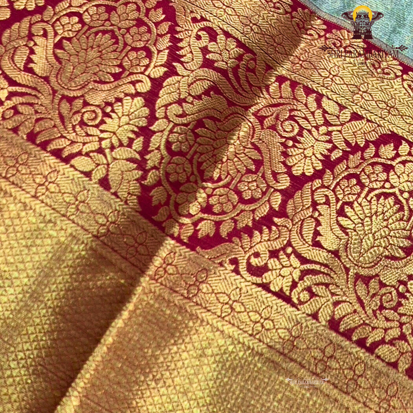 A refreshing pastel mint green (sea green) body paired with a rich deep red border Saree