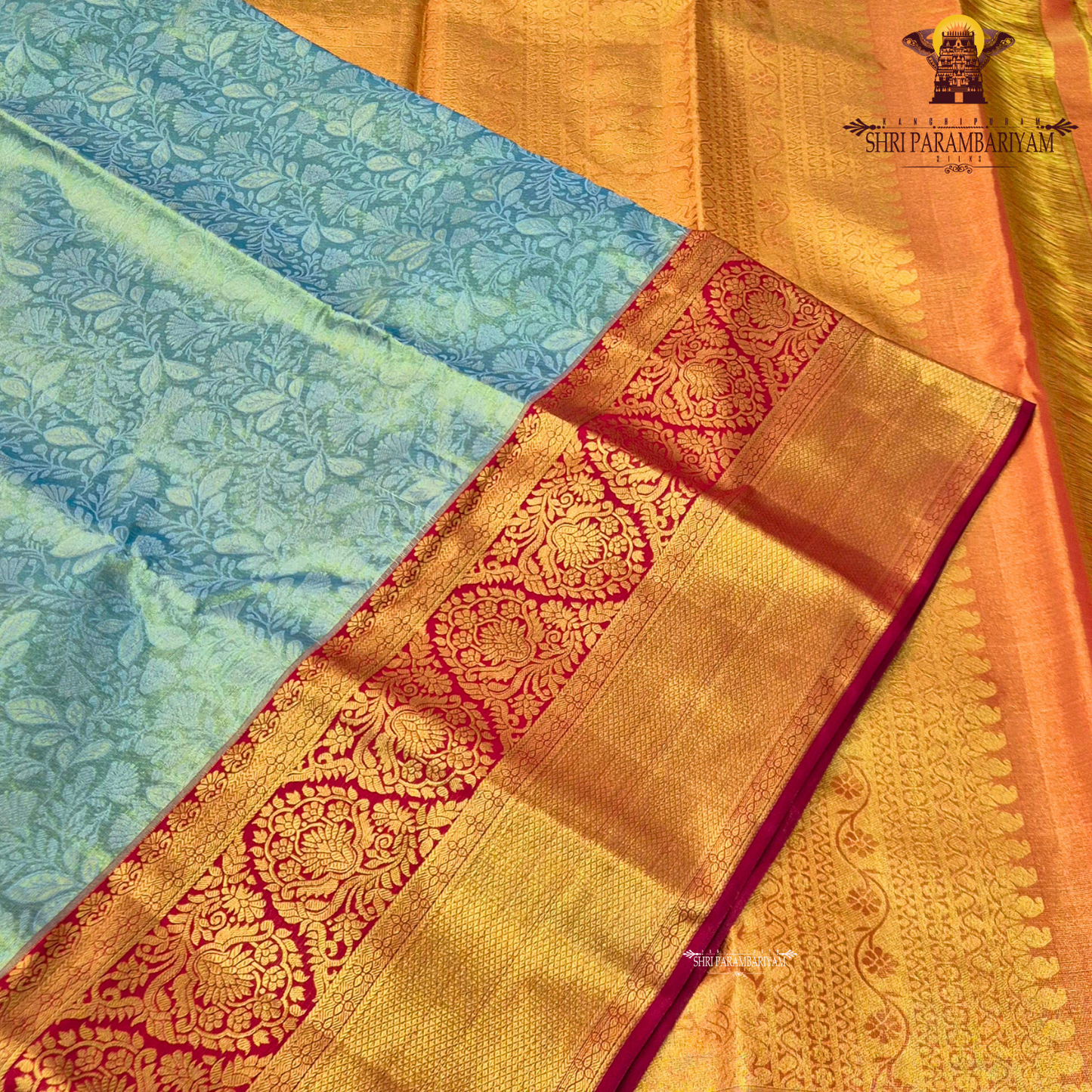 A refreshing pastel mint green (sea green) body paired with a rich deep red border Saree