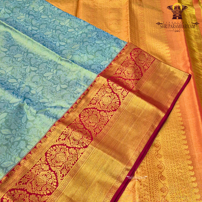 A refreshing pastel mint green (sea green) body paired with a rich deep red border Saree